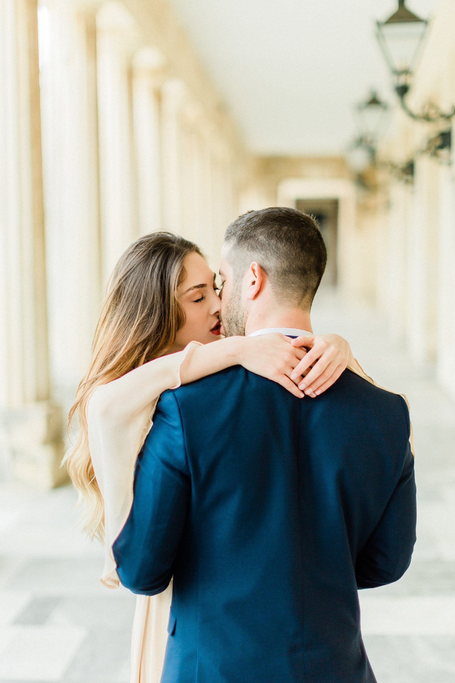 romantic kiss of a couple, while their engagement shooting at the Palace of St. Michael and St. George in Corfu.