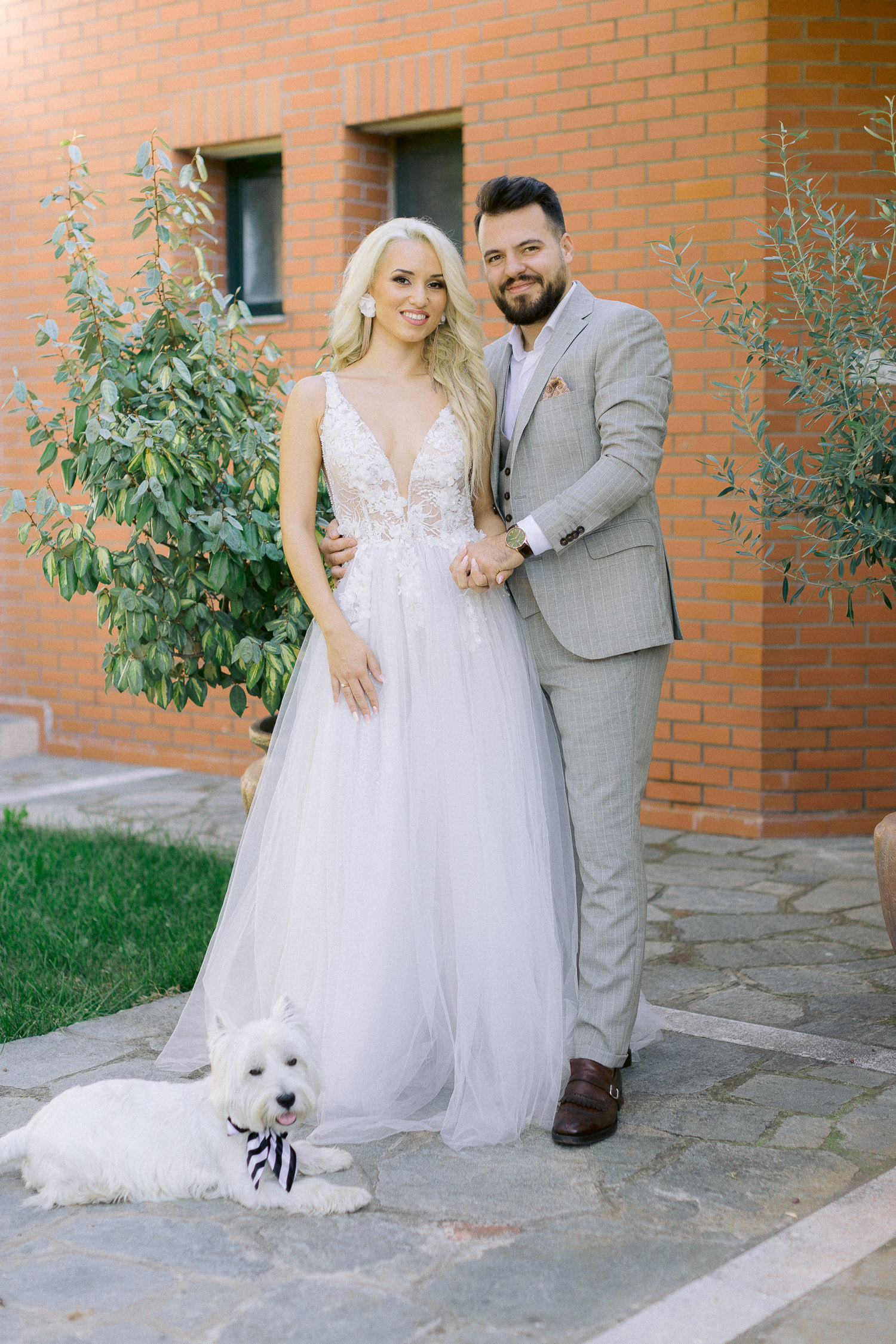romantic coastal wedding bride and groom portrait with West Highland White Terrier