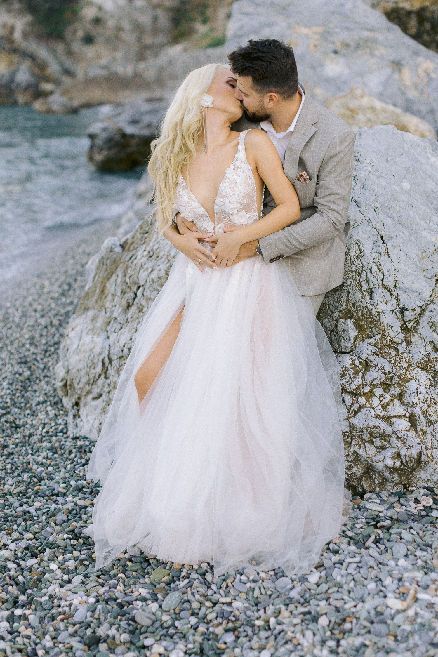 Greece beach wedding bride and groom kissing