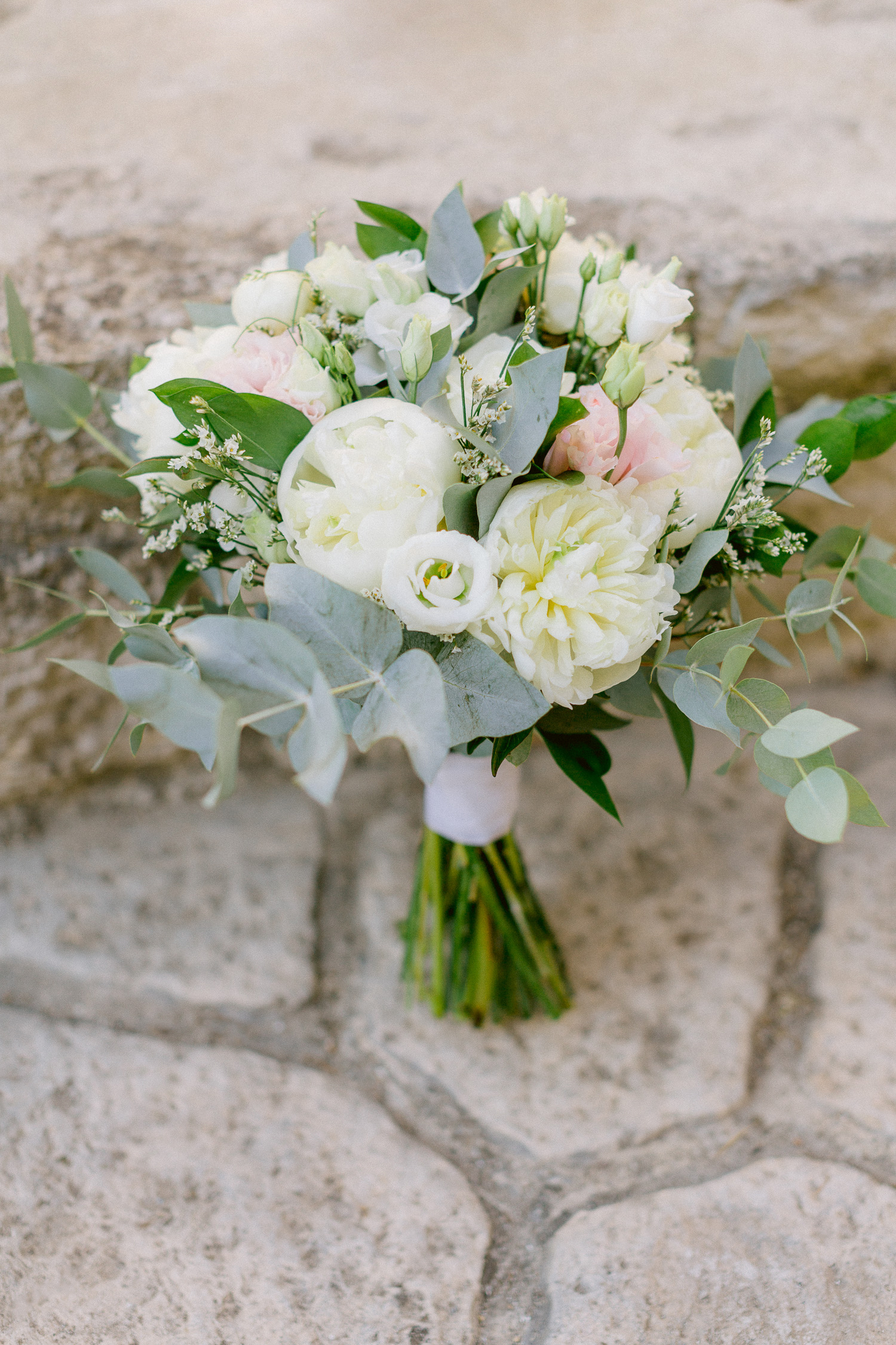 This romantic wedding bouquet made from white and pink blossoms is everything