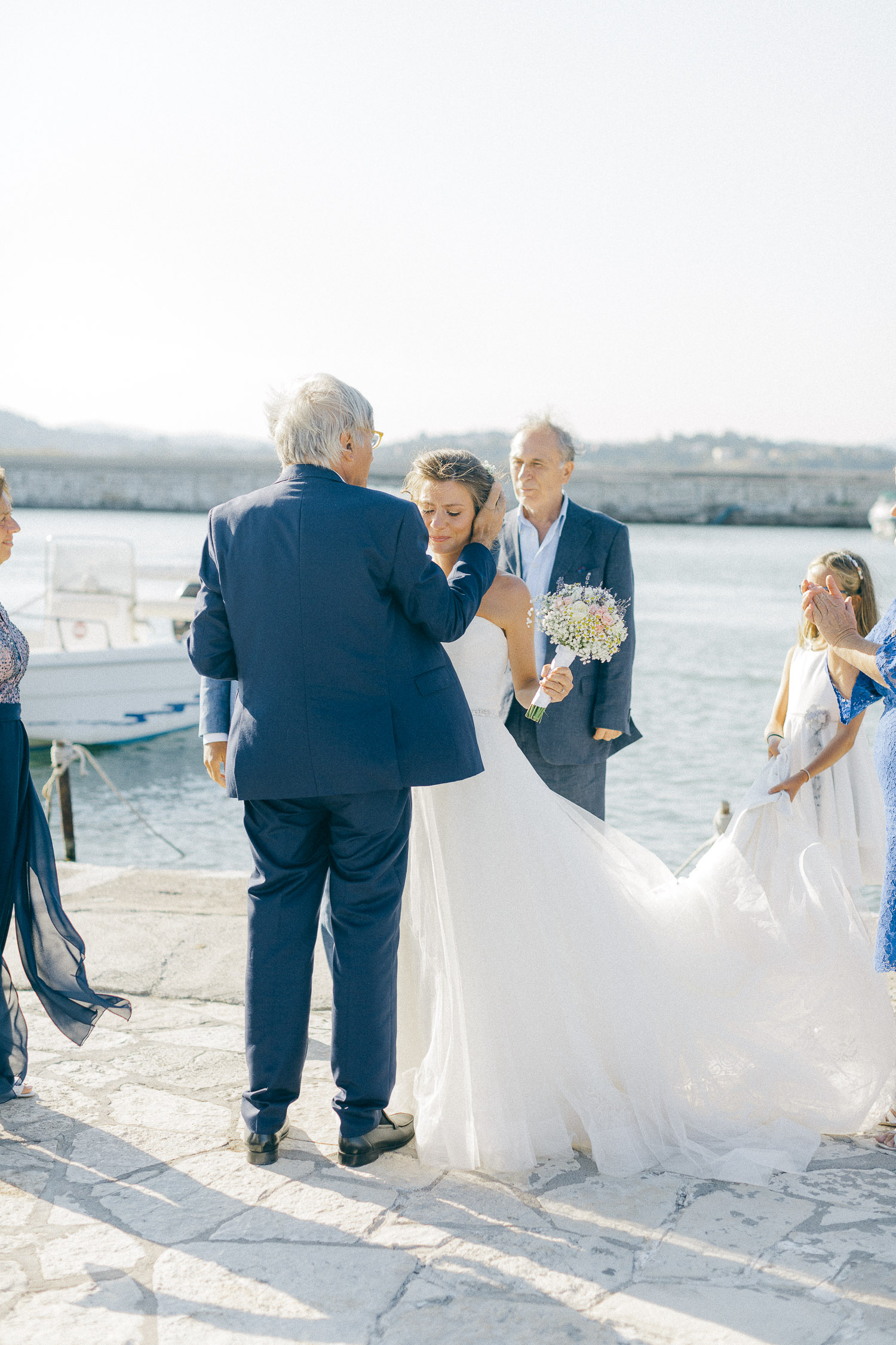 A touching moment while an Old World micro wedding in Corfu Island