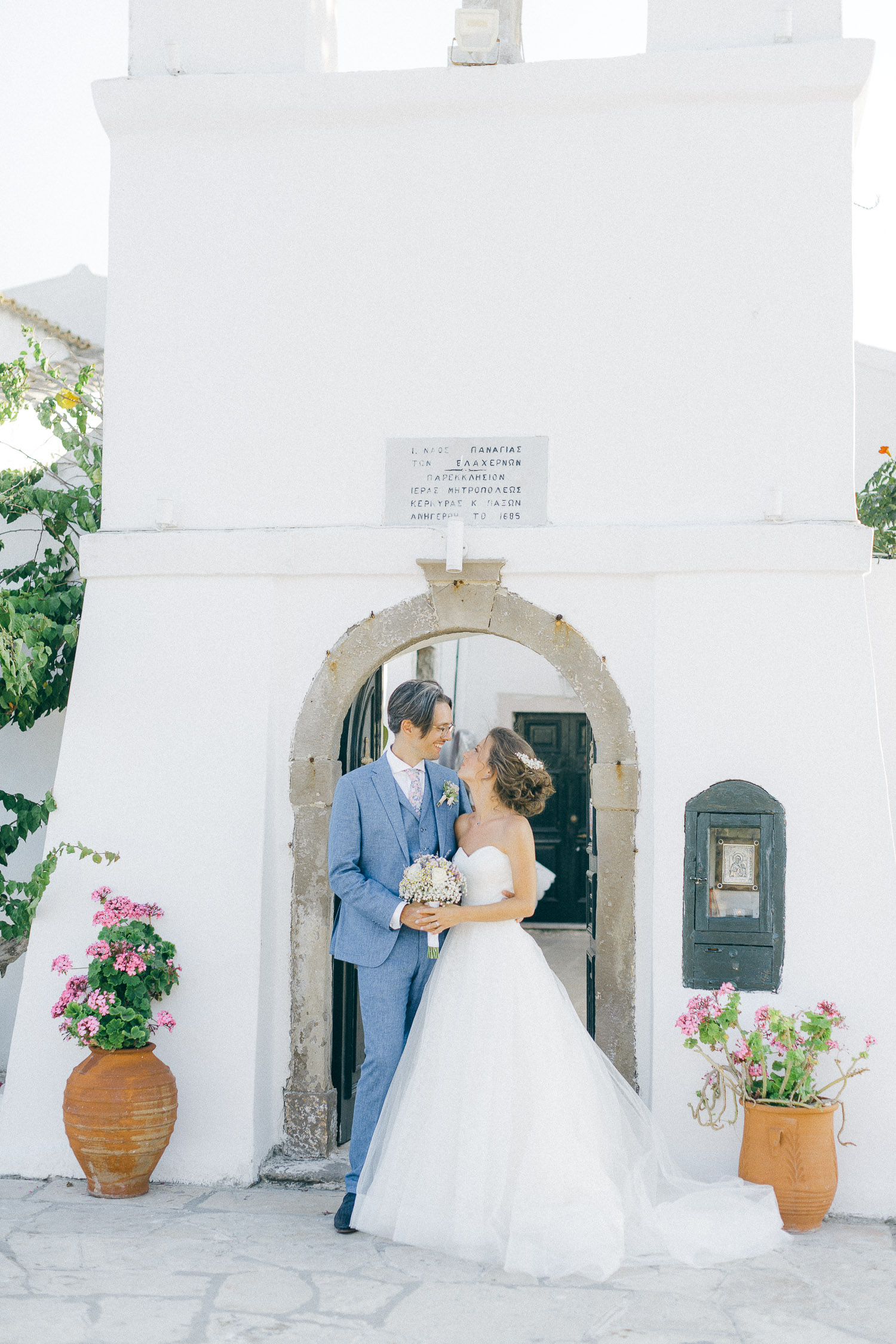 Just married couple posing so tender in front of wedding venue in Corfu Island